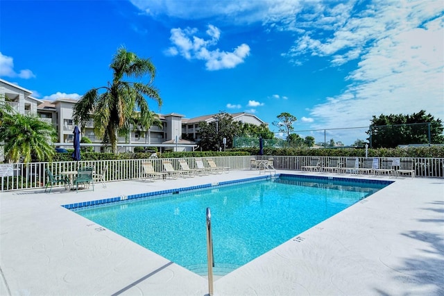 view of swimming pool with a patio area