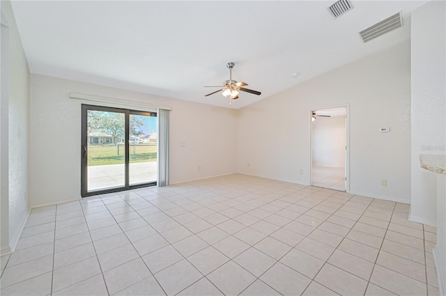 tiled spare room featuring ceiling fan and vaulted ceiling