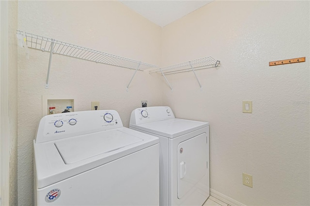 laundry area with washing machine and dryer