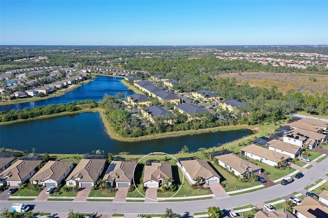 drone / aerial view with a water view