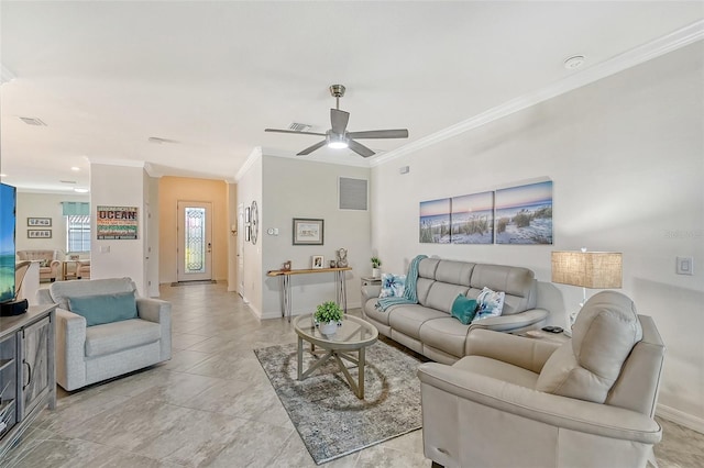 living room with ceiling fan and crown molding