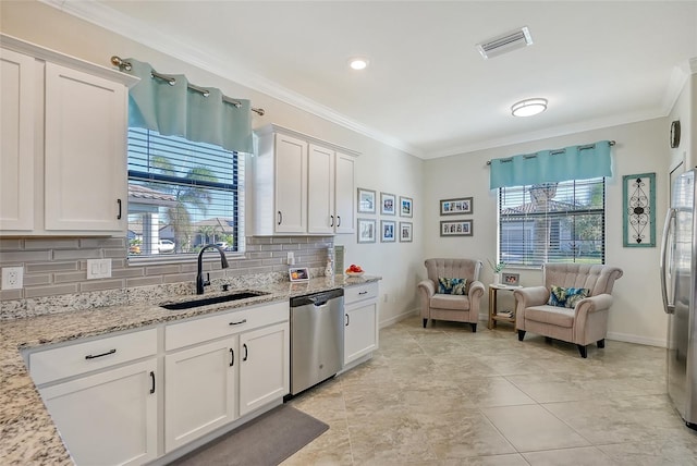 kitchen featuring white cabinets, crown molding, sink, and stainless steel appliances