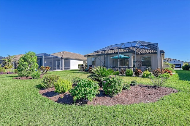 view of yard featuring glass enclosure