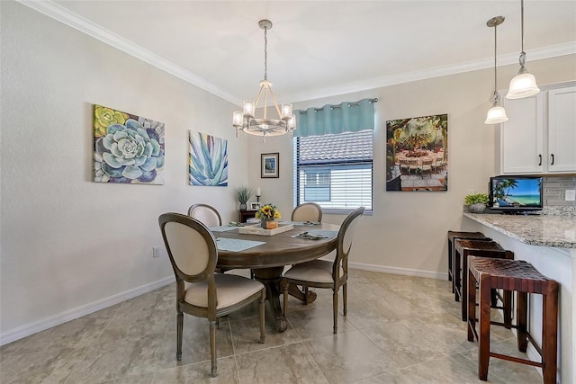 dining space with an inviting chandelier, baseboards, and ornamental molding