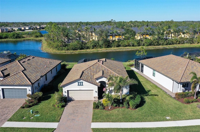 birds eye view of property with a water view