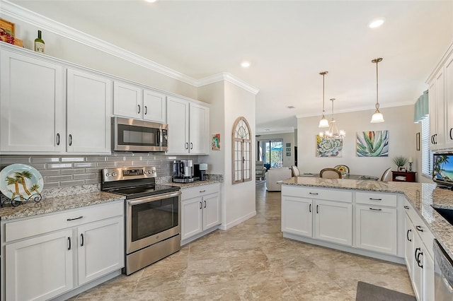 kitchen featuring appliances with stainless steel finishes, white cabinets, a peninsula, and decorative backsplash