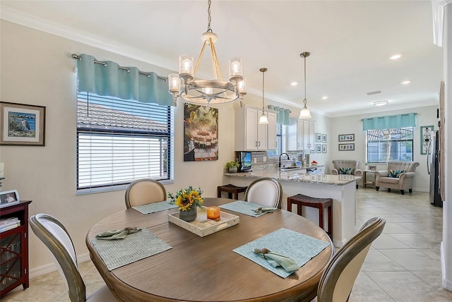 dining area with light tile patterned floors, recessed lighting, a notable chandelier, baseboards, and ornamental molding