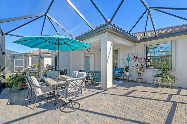 view of patio / terrace with outdoor dining area, glass enclosure, and an outdoor living space