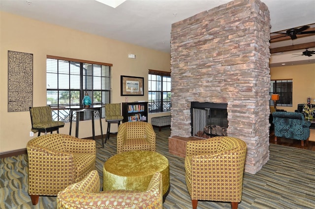 1014 Overlook Ct, Bradenton, FL 34208 - living area with ceiling fan, baseboards, a stone fireplace, and carpet