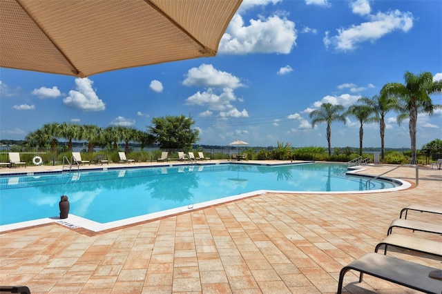 view of swimming pool with a patio