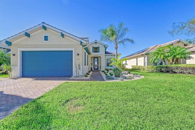 1014 Overlook Ct, Bradenton, FL 34208 - view of front of property featuring decorative driveway, an attached garage, a front yard, and stucco siding