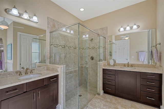 bathroom with tile patterned floors, vanity, and a shower with shower door