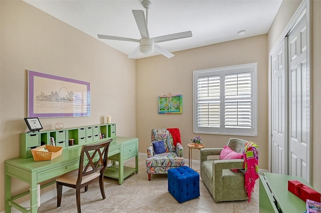 interior space with ceiling fan