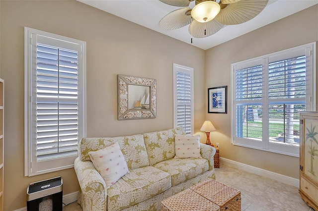 tiled living room with ceiling fan