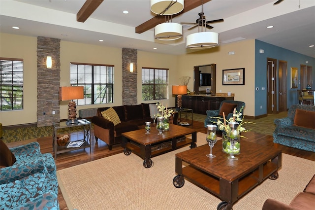 1014 Overlook Ct, Bradenton, FL 34208 - living room featuring wood finished floors, beam ceiling, ceiling fan, recessed lighting, and ornate columns