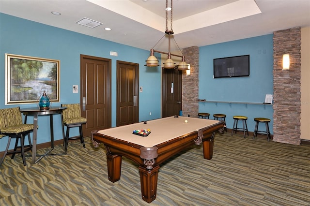 recreation room with a raised ceiling, dark carpet, and billiards