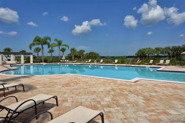 view of swimming pool featuring a patio