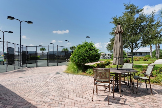 view of patio featuring tennis court