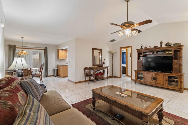 tiled living room featuring ceiling fan and lofted ceiling