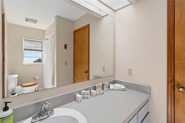 bathroom featuring sink and toilet