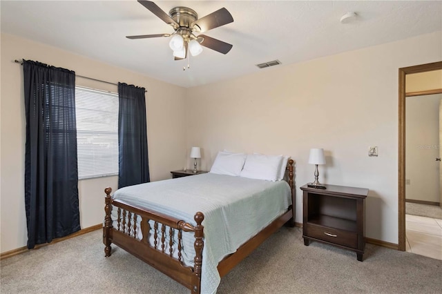 bedroom featuring light colored carpet and ceiling fan