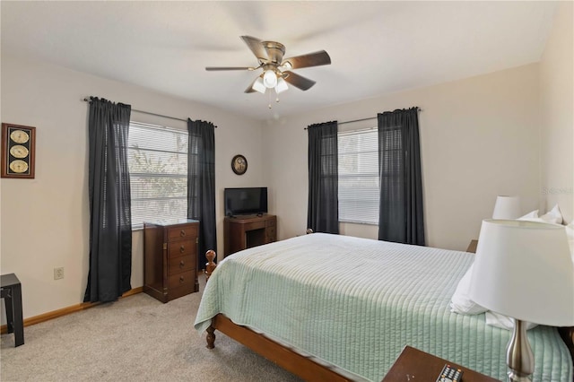 bedroom featuring light carpet and ceiling fan