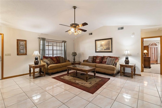 living room with ceiling fan, lofted ceiling, and light tile patterned floors