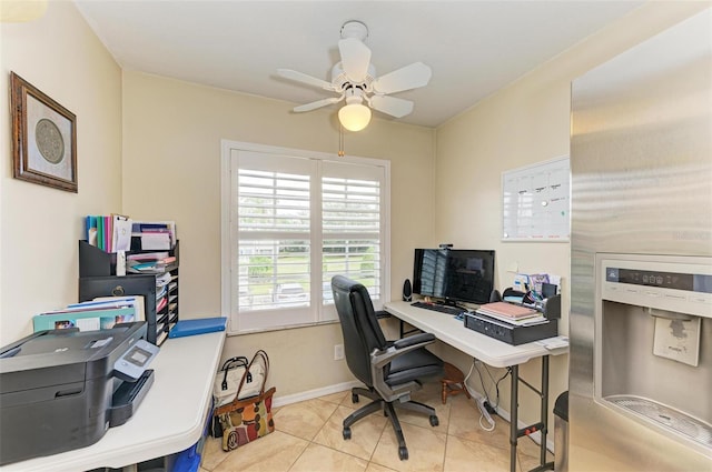 tiled home office featuring ceiling fan