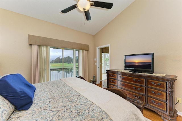 bedroom featuring hardwood / wood-style flooring, ceiling fan, access to outside, and vaulted ceiling