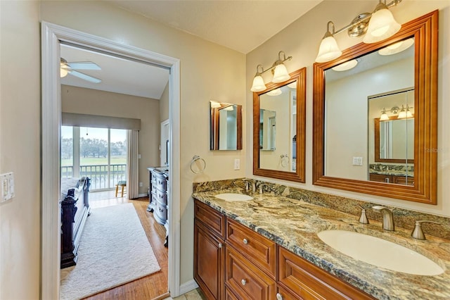 bathroom featuring ceiling fan and vanity