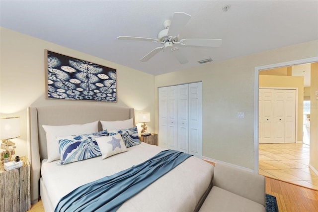 bedroom with a closet, ceiling fan, and light hardwood / wood-style floors