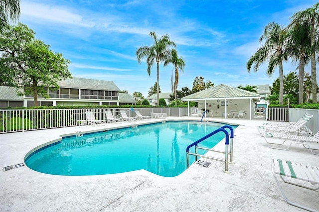 view of swimming pool with a patio