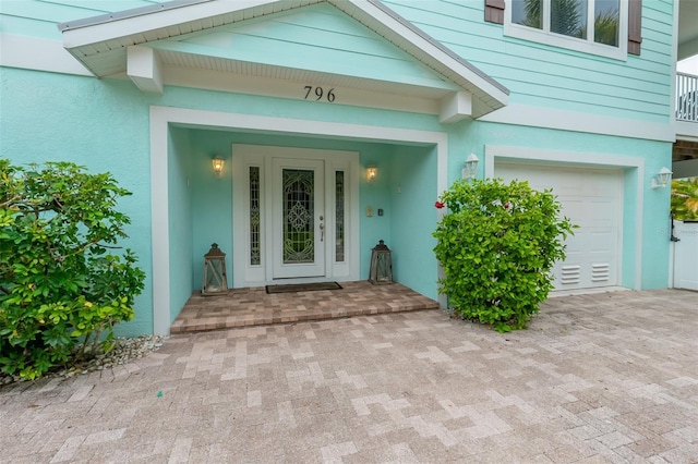 entrance to property featuring a garage