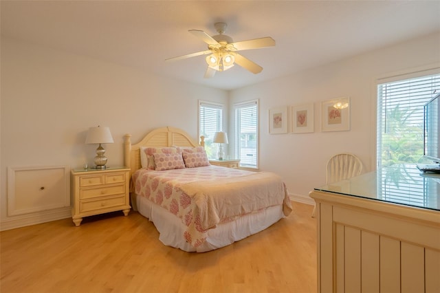 bedroom featuring light hardwood / wood-style floors and ceiling fan