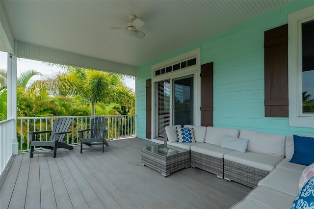 wooden deck featuring an outdoor hangout area and ceiling fan