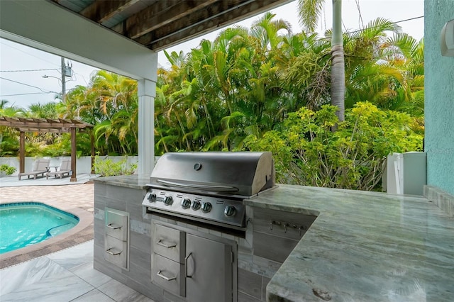 view of patio with an outdoor kitchen, grilling area, and a pergola