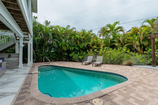 view of pool featuring a patio