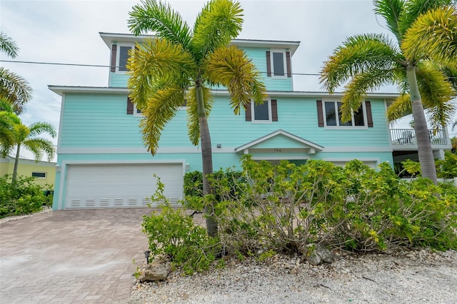 raised beach house with a garage