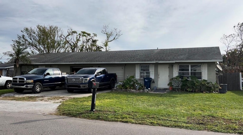 ranch-style house with a front yard