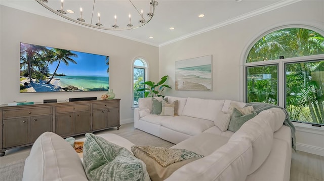 living room featuring a chandelier and ornamental molding