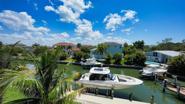 510 Bowsprit Ln, Longboat Key, FL 34228 - dock featuring boat lift, a water view, and a residential view