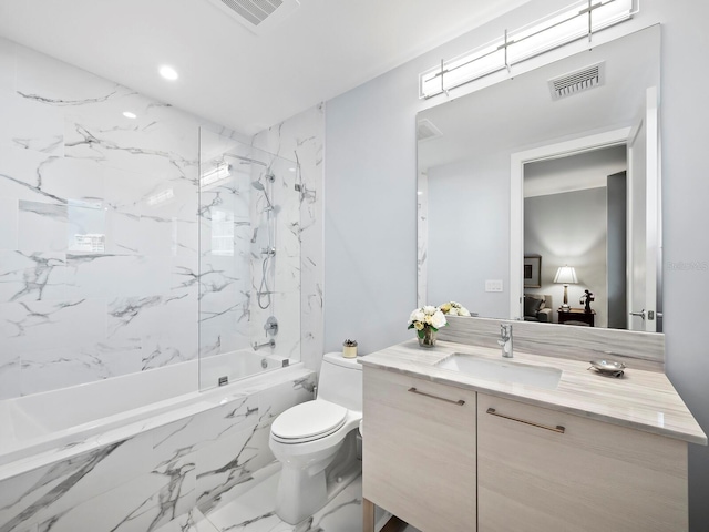 full bathroom featuring vanity, tiled shower / bath combo, and toilet