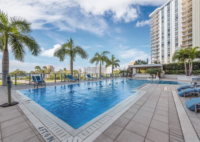 view of swimming pool featuring a patio area