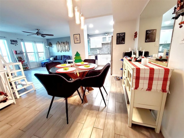 dining room featuring ceiling fan and light wood-type flooring