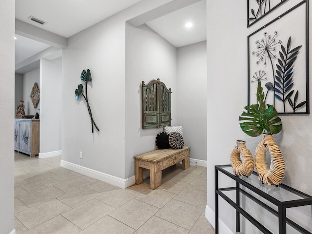 hallway with light tile patterned floors