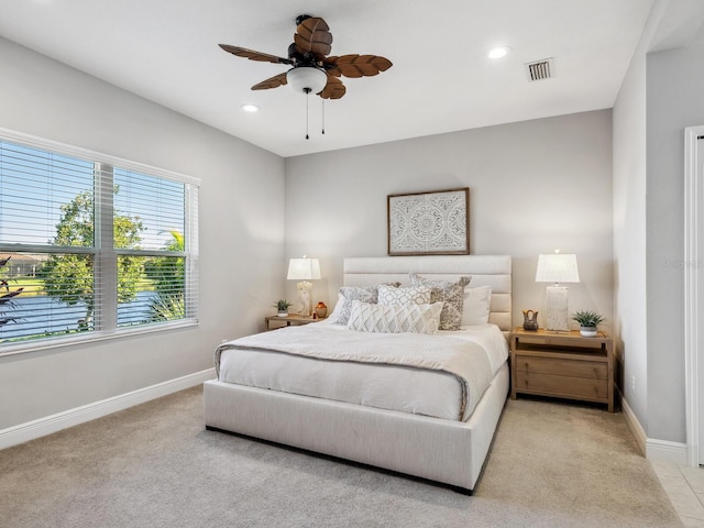 carpeted bedroom with ceiling fan