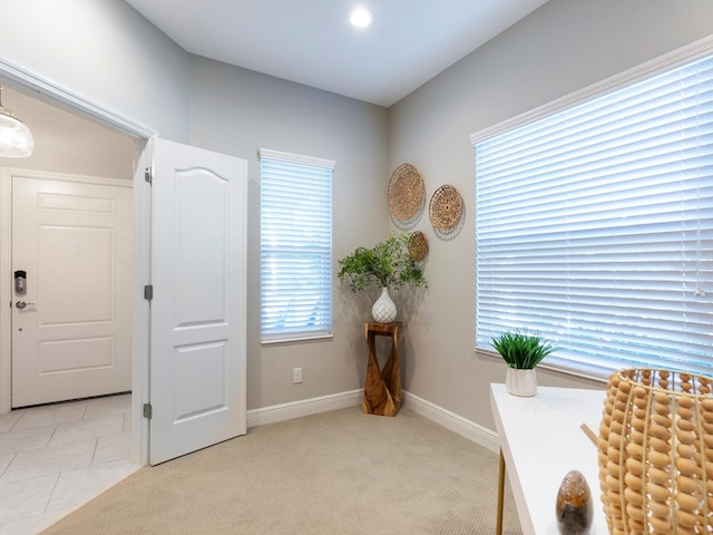 sitting room with light colored carpet