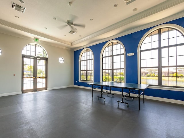 playroom featuring ceiling fan, plenty of natural light, french doors, and ornamental molding