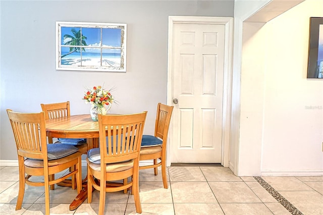 dining area with light tile patterned floors