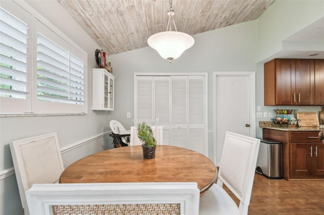 dining area with wooden ceiling, lofted ceiling, and wood-type flooring